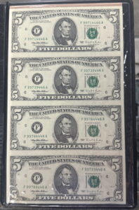 Uncut sheet of $5 notes